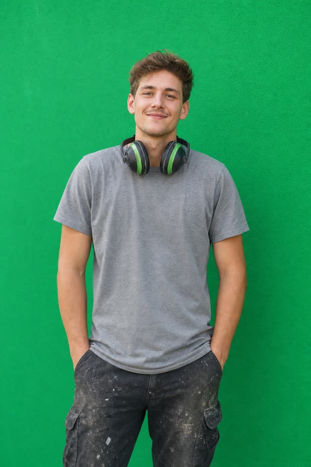 A new groundskeeper with ear defenders around his neck